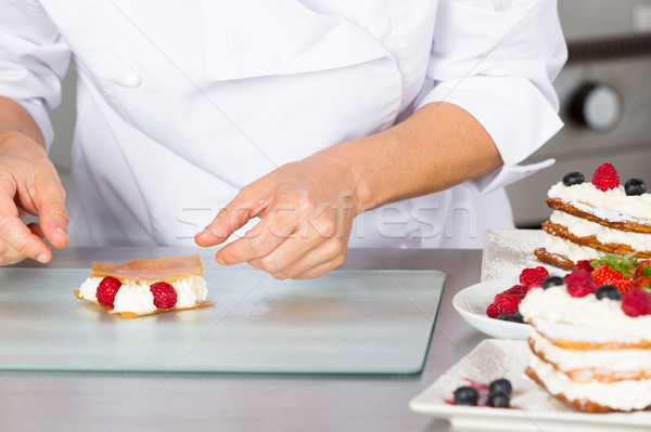 Pastry chef decorating Stock photo © fotoedu