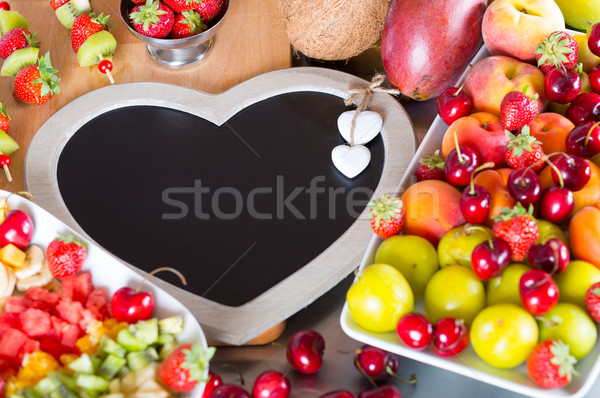 Vegyes gyümölcssaláta asztal előkészített választék gyümölcsök Stock fotó © fotoedu