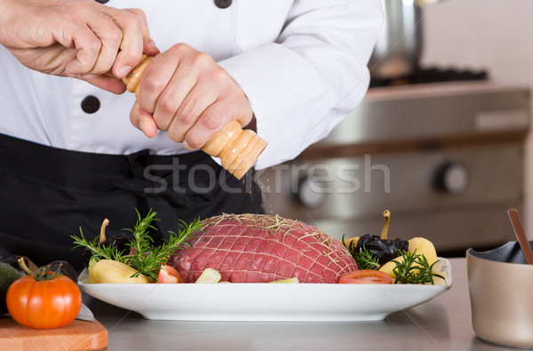 Chef preparing a dish Stock photo © fotoedu