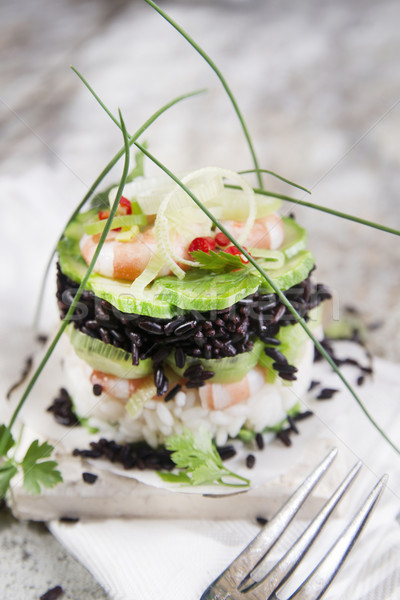 Stock photo: Tower of black and white rice with shrimp and zucchini