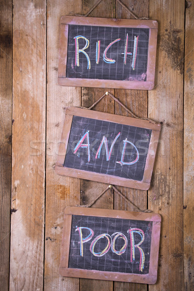 Reichen armen Tafel Worte geschrieben Kreide Stock foto © Fotografiche