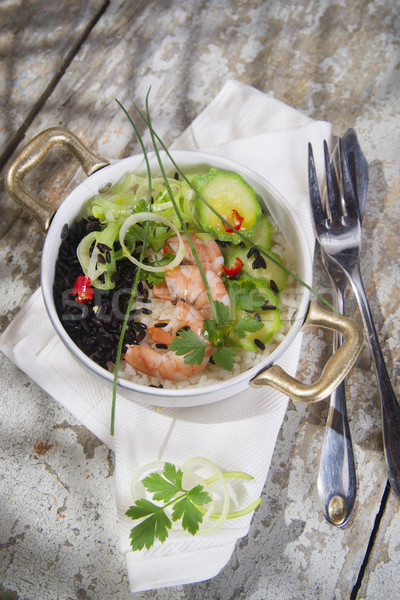 Black and white risotto with shrimp and zucchini Stock photo © Fotografiche