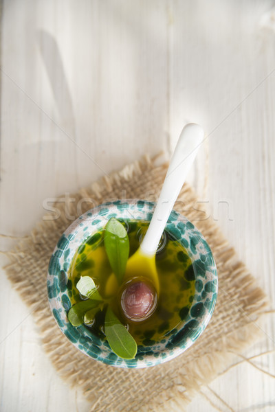 Stock photo: Small container with extra virgin olive oil 