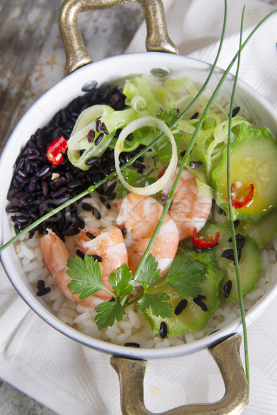 Black and white risotto with shrimp and zucchini Stock photo © Fotografiche