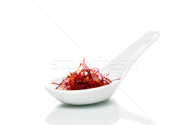 Saffron (Crocus sativus) threads on porcelain spoons Stock photo © fotoquique