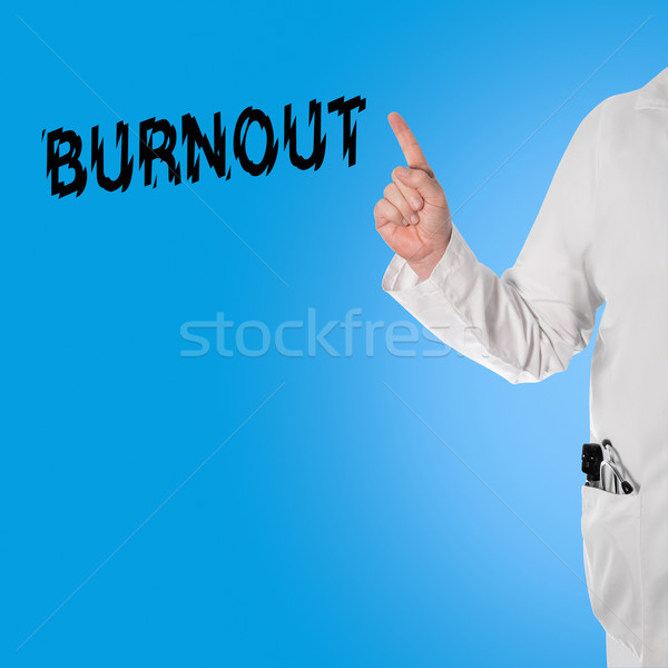 Doctor pointint at the word Burnout Stock photo © fotoquique