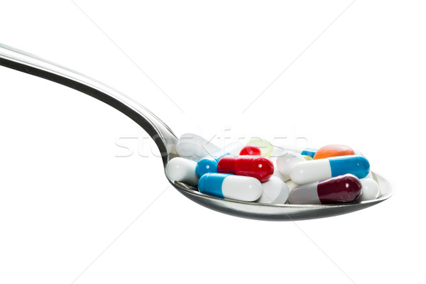 Pills on a tablespoon Stock photo © fotoquique
