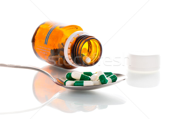Tablets on a spoon Stock photo © fotoquique