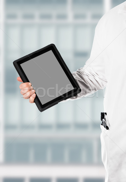 Doktor with a digital tablet Stock photo © fotoquique