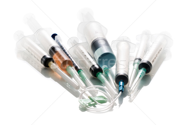 Various syringes filled with colored liquids Stock photo © fotoquique