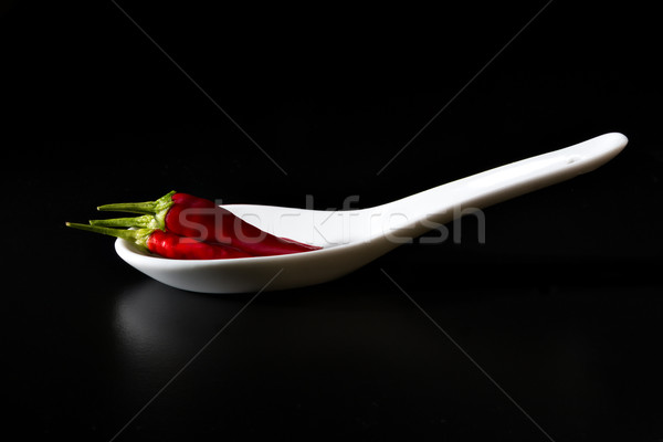 Chili (Capsicum) on a tablespoon Stock photo © fotoquique