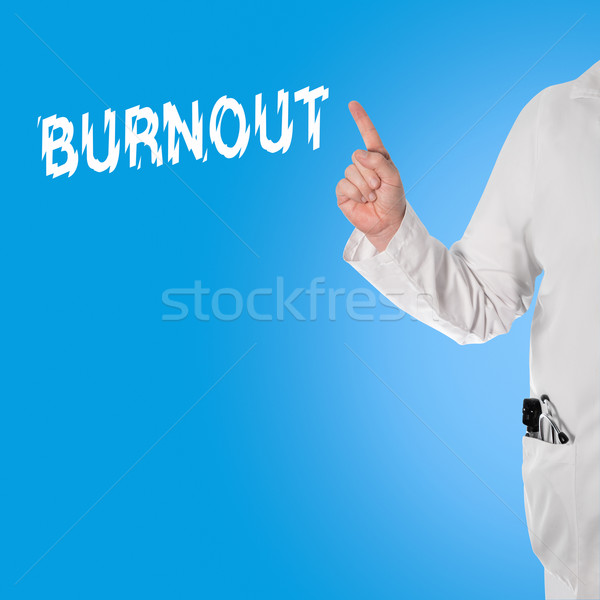 Doctor pointint at the word Burnout Stock photo © fotoquique