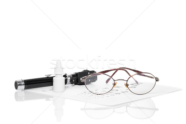 Ophthalmoscope, eye test and glasses Stock photo © fotoquique