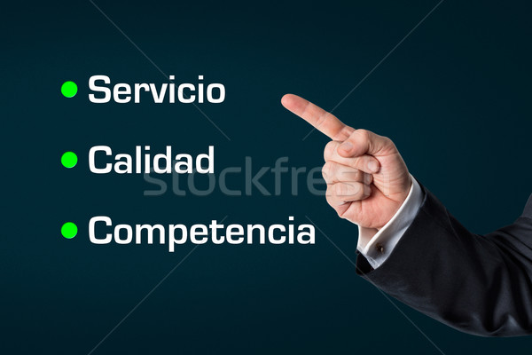 Business man pointing at the words -Service, Quality, Competence Stock photo © fotoquique