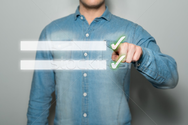 человека указывая виртуальный молодым человеком серый Сток-фото © fotoquique