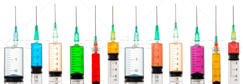 Various syringes filled with colored liquids Stock photo © fotoquique