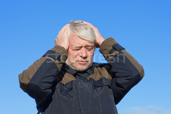 Portrait of middle-aged man on blue sky of the background. Stock photo © fotorobs