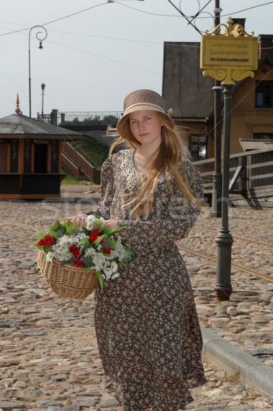 Stock photo: Girl with basket of flowers