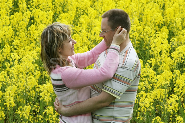 Couple in flower meadow Stock photo © fotorobs