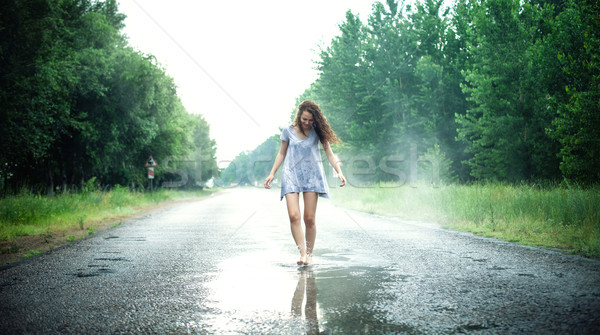 Lány pocsolya gyönyörű lány út fa mosoly Stock fotó © FotoVika