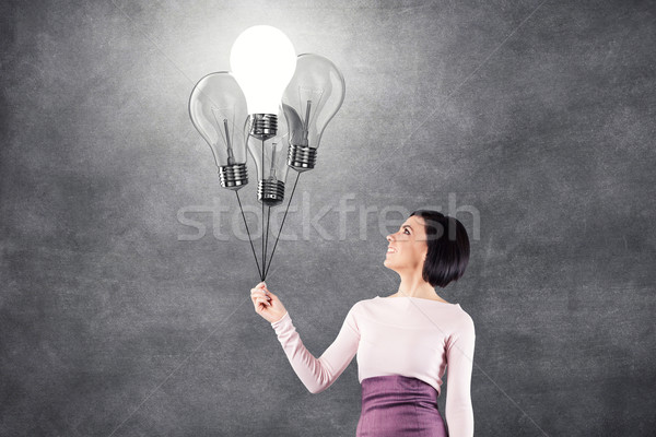 Girl with lightbulbs Stock photo © FotoVika