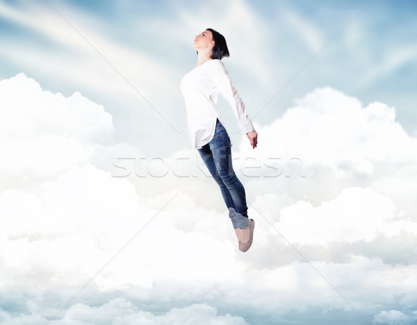 Stock photo: Girl in a clouds