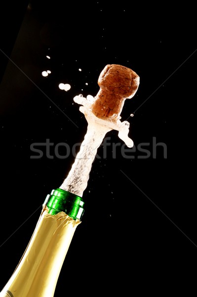 Stock photo: Cork Shooting Out Champagne Bottle