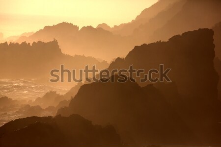 Stockfoto: Zonsondergang · rotsen · zee · silhouet · schets · ruig