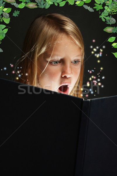 Young Girl Reading a Fantasy Book Stock photo © fouroaks