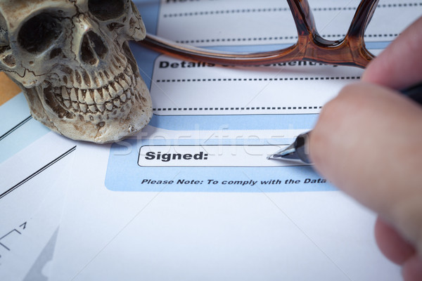 Signature field on document with pen and skull signed here; docu Stock photo © FrameAngel