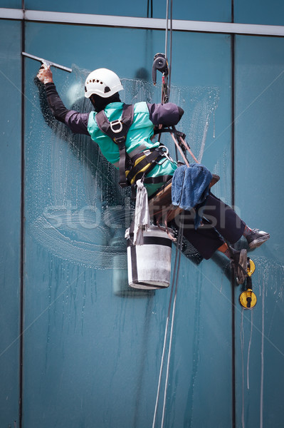 group of workers cleaning windows service on high rise building Stock photo © FrameAngel