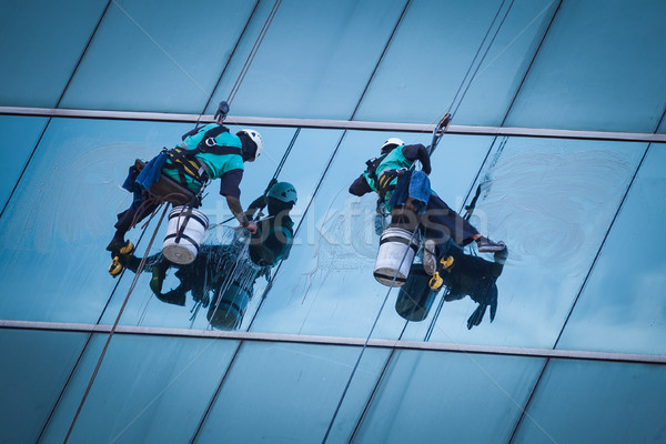 group of workers cleaning windows service on high rise building Stock photo © FrameAngel