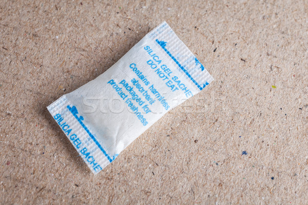 Close up silica gel or desiccant in paper bag background Stock photo © FrameAngel