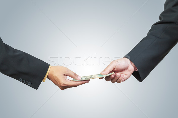 businessman hand and money to other for corruption concept Stock photo © FrameAngel