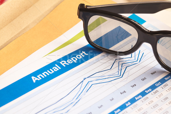 Annual Report letter document and eyeglass  Stock photo © FrameAngel