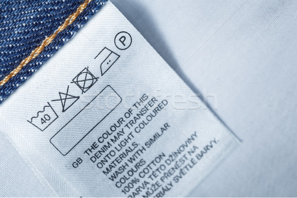 Clothing label with laundry care instruction, close up Stock photo © FrameAngel