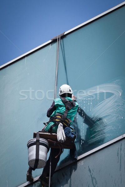 group of workers cleaning windows service on high rise building Stock photo © FrameAngel