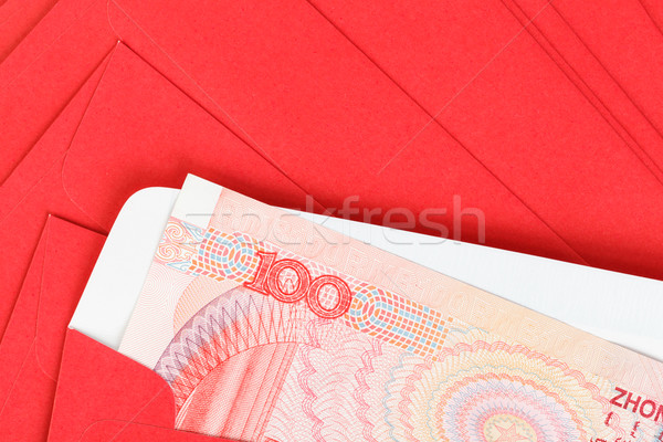 Chinese or 100 Yuan banknotes money in red envelope, as chinese  Stock photo © FrameAngel