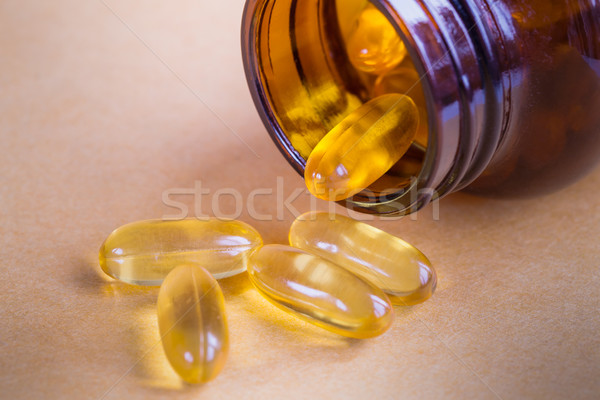 Geel pillen fles gelukkig gezondheid Stockfoto © FrameAngel