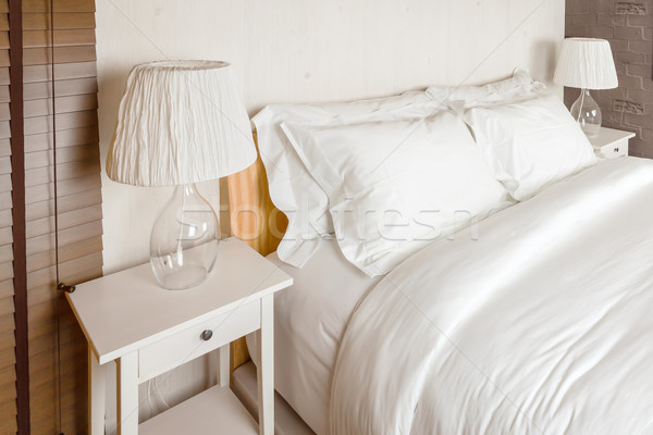 two pillow on bedroom with white bed sheet and lamp Stock photo © FrameAngel