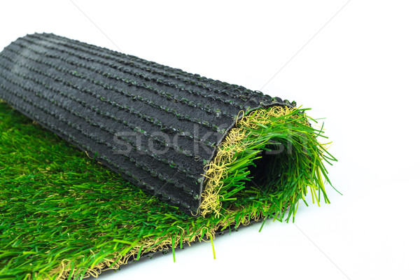 Artificial turf green grass roll on white background Stock photo © FrameAngel