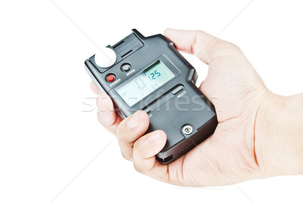 Stock photo: hand holding lightmeter isolated on white background 