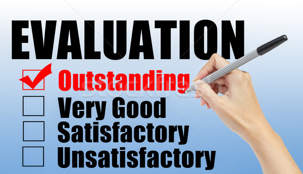 Evaluation form and hand check outstanding Stock photo © FrameAngel