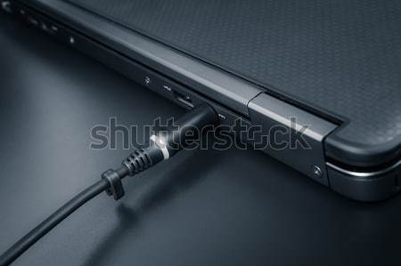 close up of battery charge on laptop computer with power plug Stock photo © FrameAngel