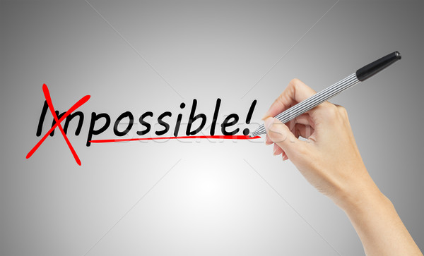 hand drawing and  changing the word impossible to possible, busi Stock photo © FrameAngel