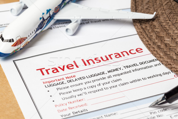 Travel Insurance Claim application form and hat with eyeglass an Stock photo © FrameAngel