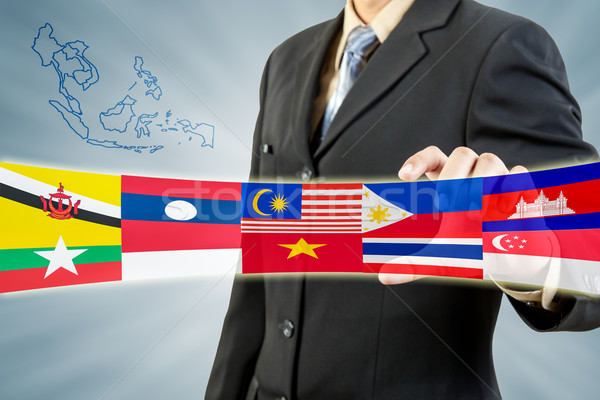 ASEAN Economic Community in businessman hand  Stock photo © FrameAngel