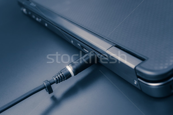 close up of battery charge on laptop computer with power plug Stock photo © FrameAngel