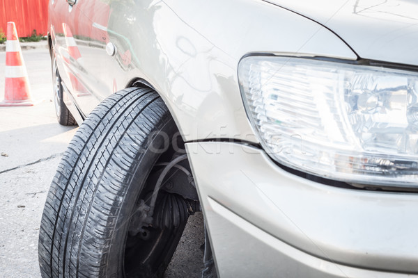 Car crash accident, impact to front wheel axle and bumper is bro Stock photo © FrameAngel