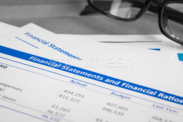 Financial statement letter on brown envelope and eyeglass, busin Stock photo © FrameAngel